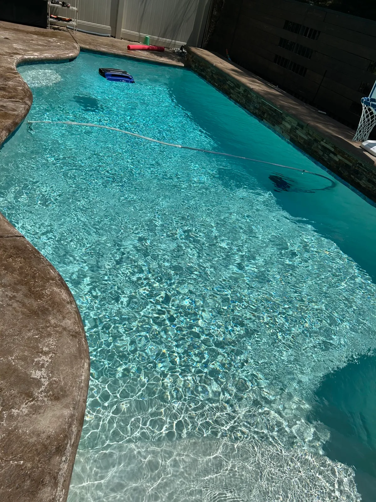 Crystal-clear backyard pool after Banana Pool & Spa Service in Temescal Valley, CA
